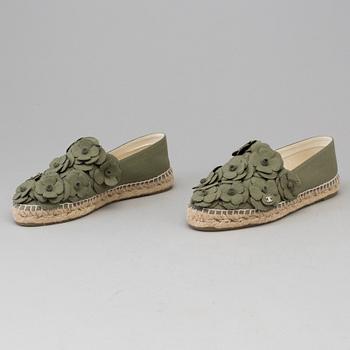 A pair of espadrilles from Chanel.