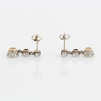 A pair of 18K gold earrings set with old-cut diamonds with a total weight of ca 4.75 cts.