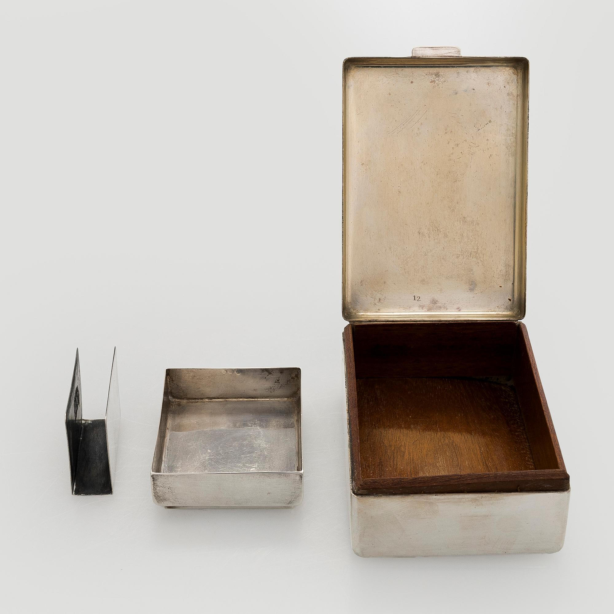 A silver cigarette case, matchbox holder and small bowl, Sandrik, as well as 3 ashtrays, Czechoslovakia 1929-1945.