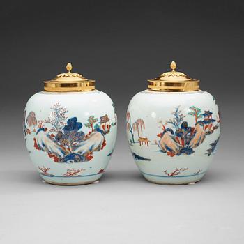 243. A pair of imari jars with gilt bronze covers. Qing dynasty, early 18th Century.