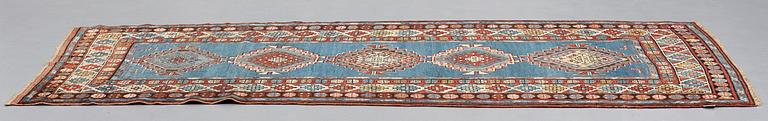 A RUNNER, a semi-antique Caucasian, ca 303,5 x 129,5-140,5 cm (as well as one end with 2,5 cm flat weave).
