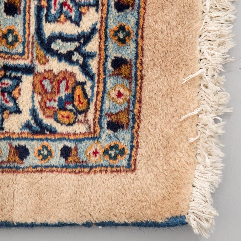 A carpet from Mashad, around 381 x 297 cm.