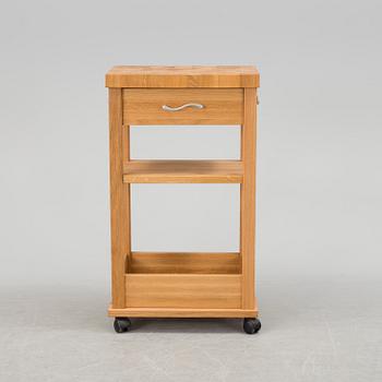 A 21th century oak kitchen island.