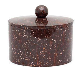 673. A Swedish Empire 19th century porphyry tobacco jar with cover.