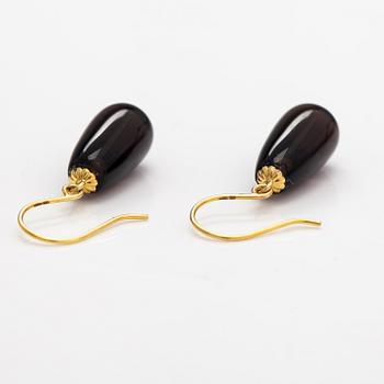 A pair of 14K gold earrings with smoaky quartzes.