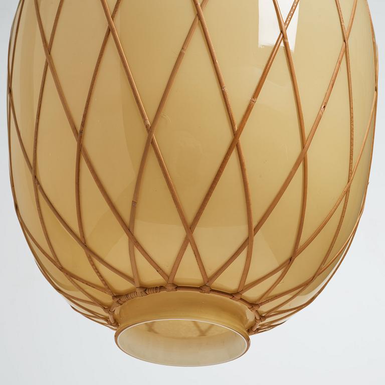 A pair of Swedish Modern vanilla coloured glass ceiling lights with fretted rattan, 1930-40's.