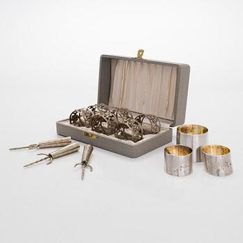 Napkin rings, 9 pcs, silver, Finland and Germany 1898-1968, and corn forks, 3 pcs, sterling silver, Mexico.