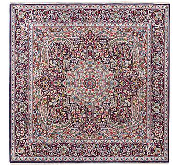 A Kerman rug, c. 149 x 147 cm.