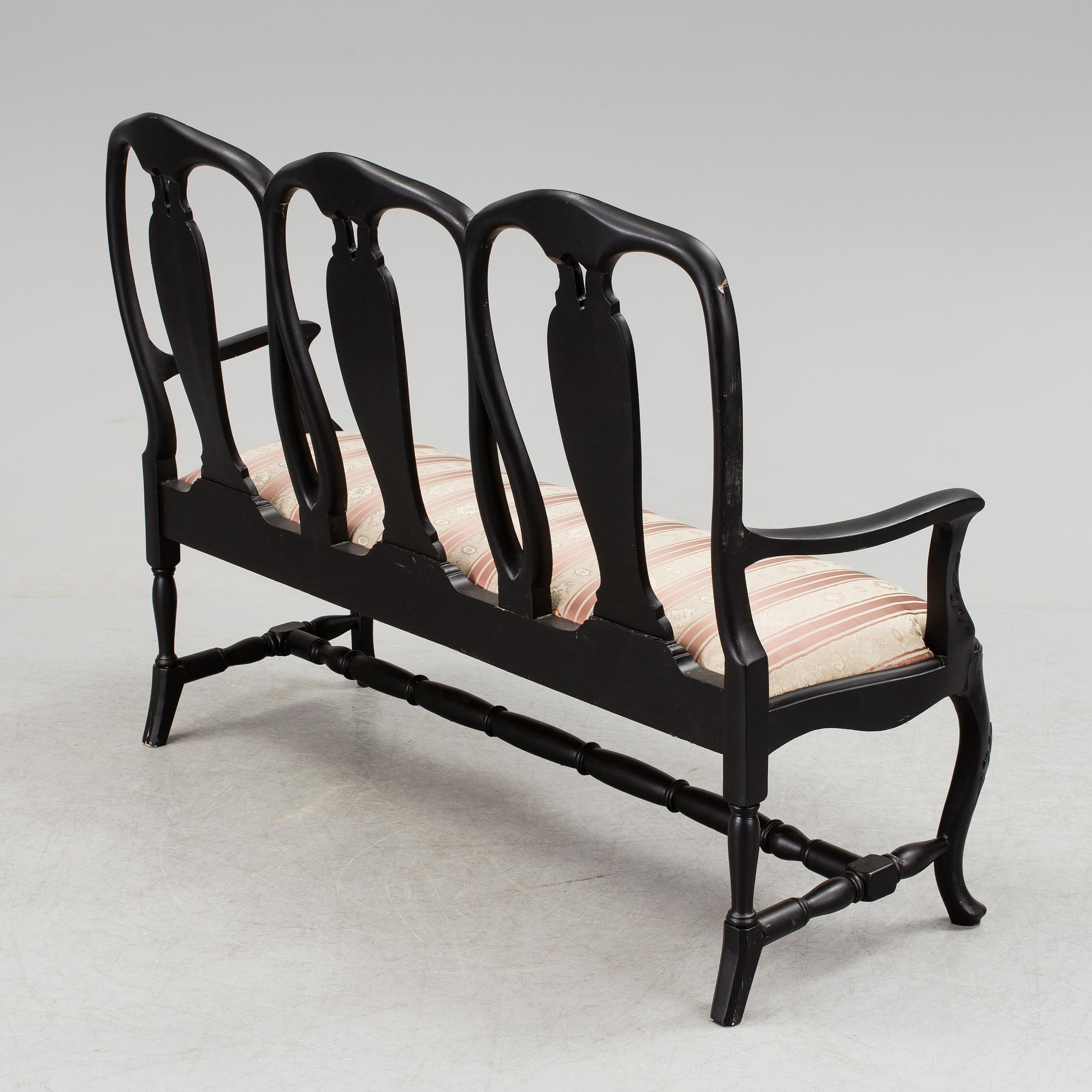 A mid 1900s rococo style sofa.