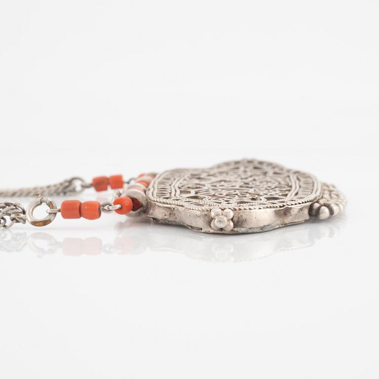 Silver and coral necklace.