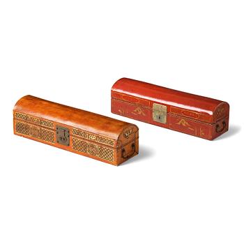 1016. Two leather clad and lacquered chests, late Qing dynasty.