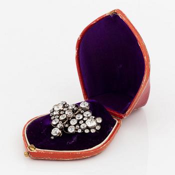 A gold and silver brooch set with old-cut diamonds.