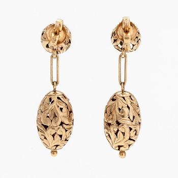 A pair of 14K gold earrings.