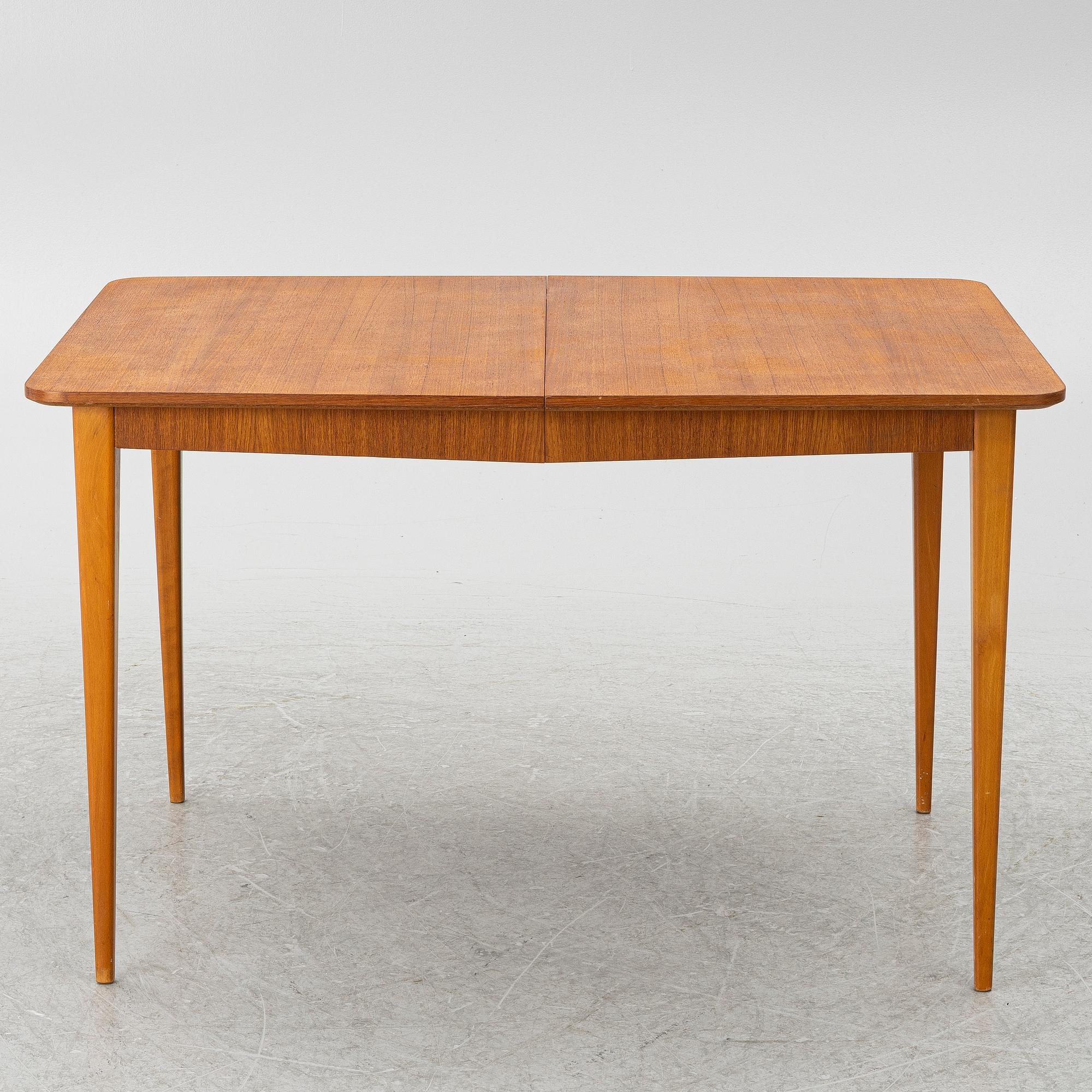 A mid20th century dining table.