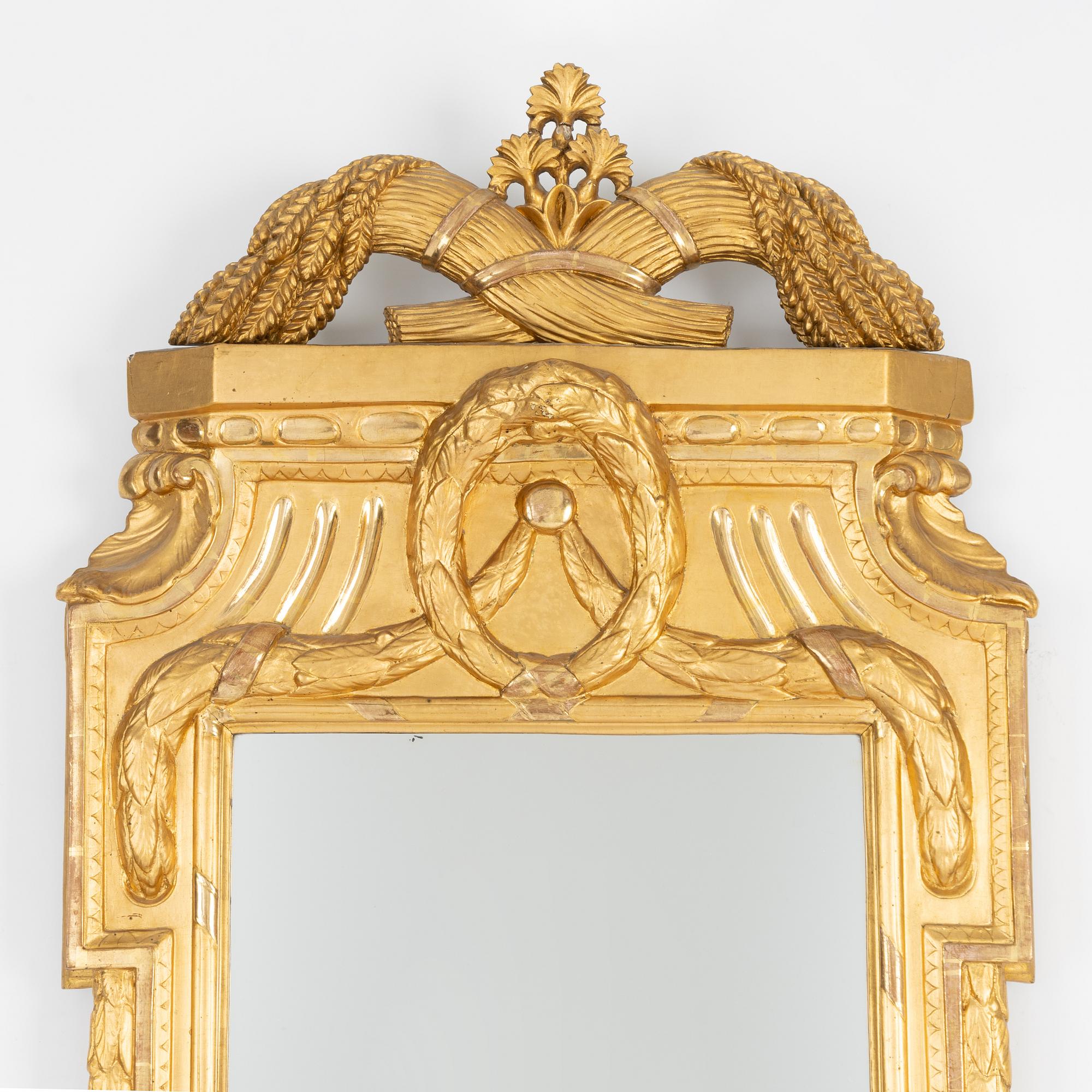 A Gustavian giltwood mirror by J. Åkerblad (master in Stockholm 1758-99).