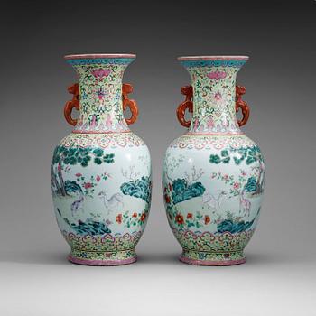 319. A pair of famille rose vases, Qing dynasty with Qianlong seal mark.