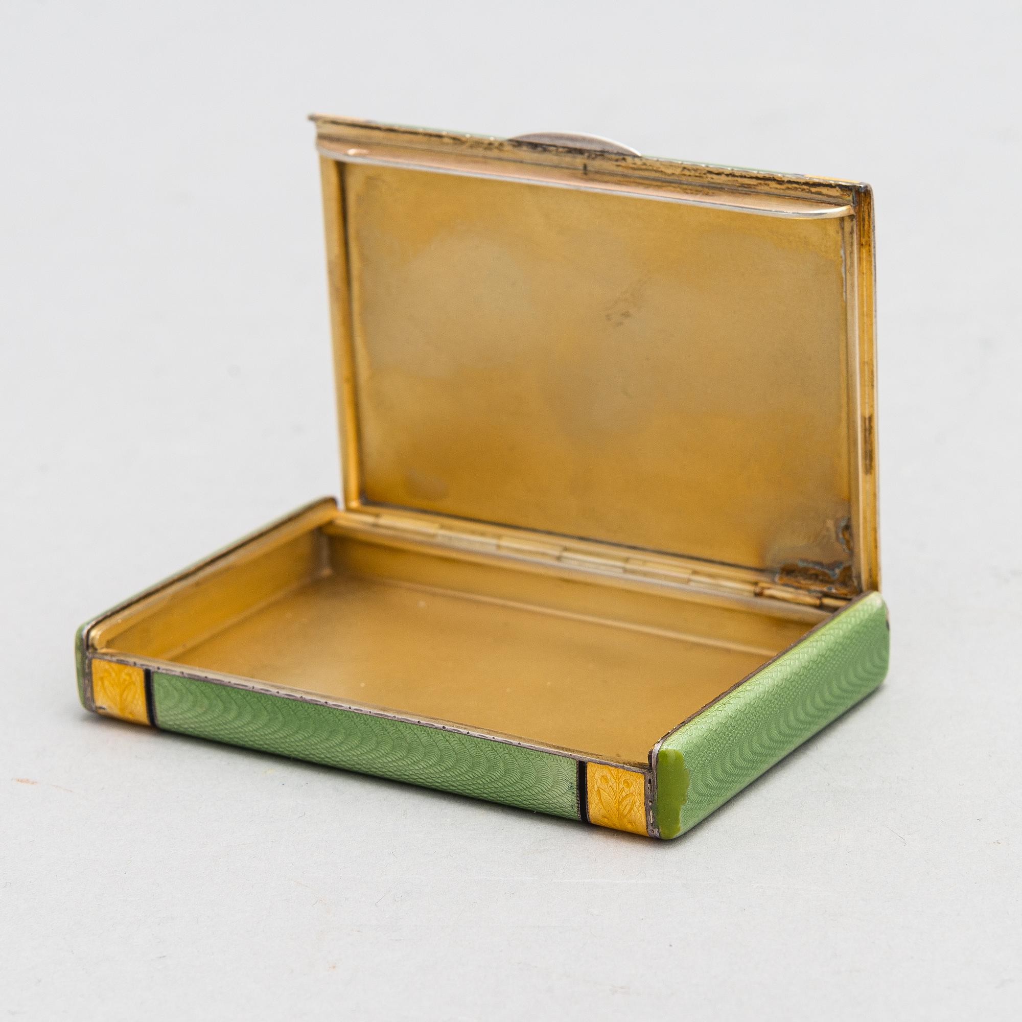 A gilded silver cigarette case with enamel and rose-cut diamonds. Moscow, early 20th century.