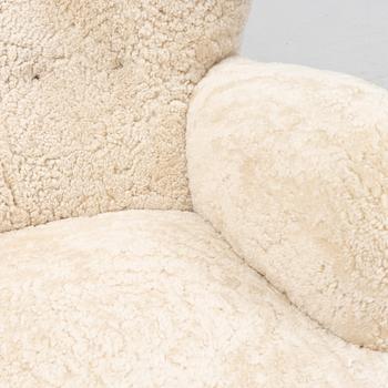 A lounge chair with new sheepskin upholstery, Denmark, 1940's.