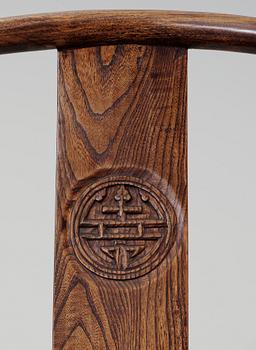 A pair of hardwood horseshoeback armchairs, Qing dynasty.