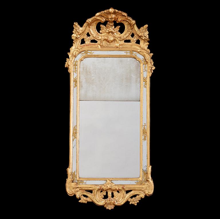 A Swedish Rococo 18th century mirror, dated 1769.