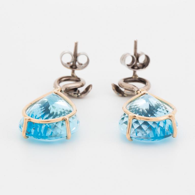 Drop shaped blue topaz and diamond earrings.
