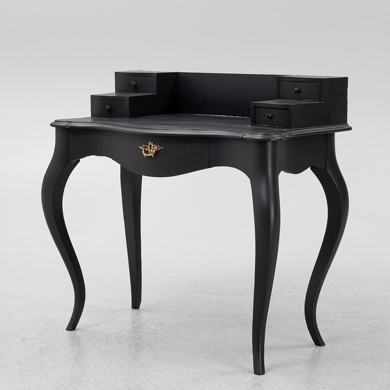 A painted rococo style writing desk, from around the year 1900.