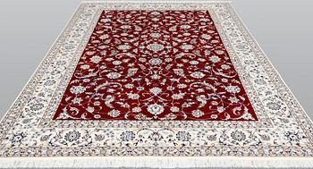 A Nain part silk carpet, 302 x 204 cm.
