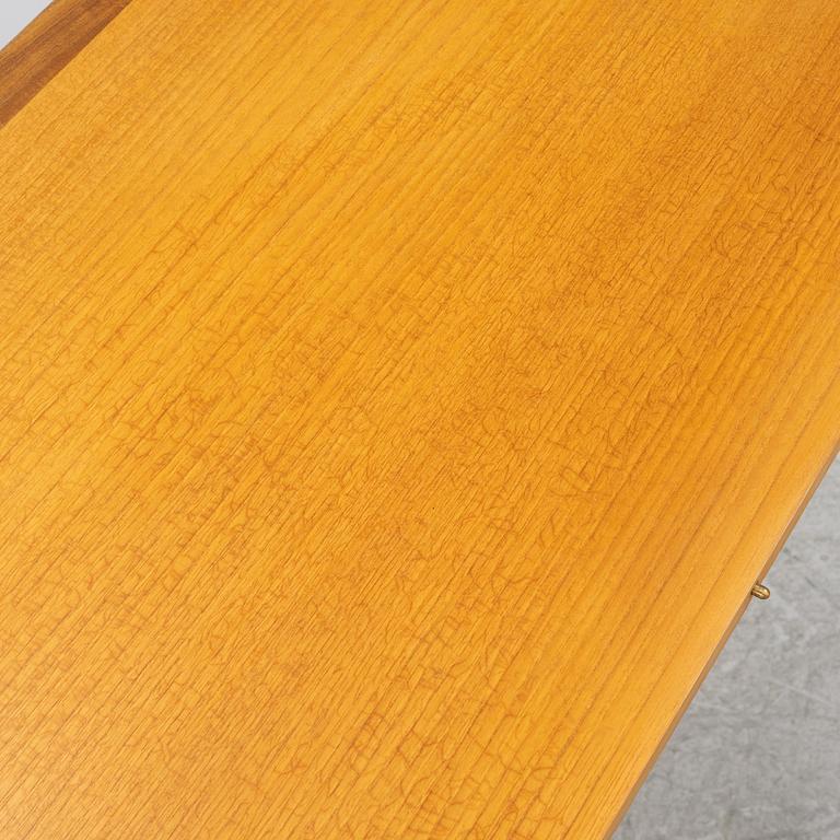 A dining table and four chairs, 1950s-60s.