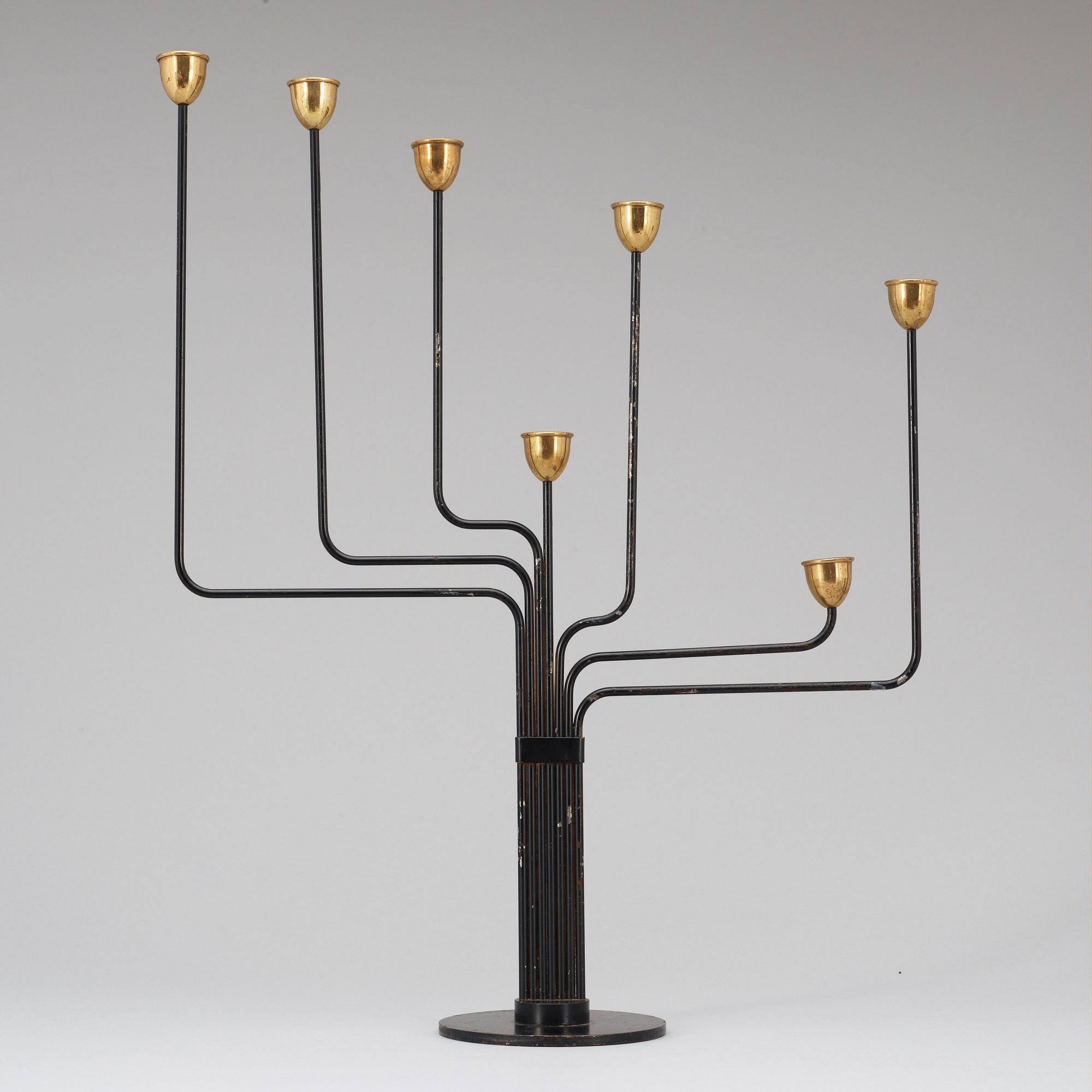 A Piet Hein brass and black lacquered metal candelabrum, 1950's-60's.