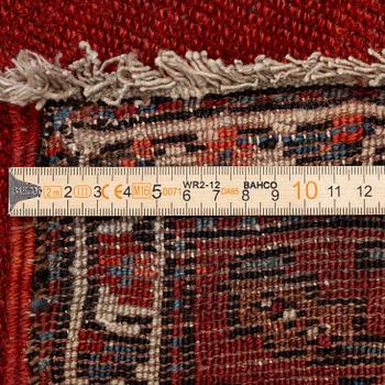 A Malayer runner, west Persia, c. 560 x 200 cm.