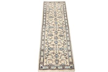 A Nain runner, part silk, c. 288 x 64 cm.
