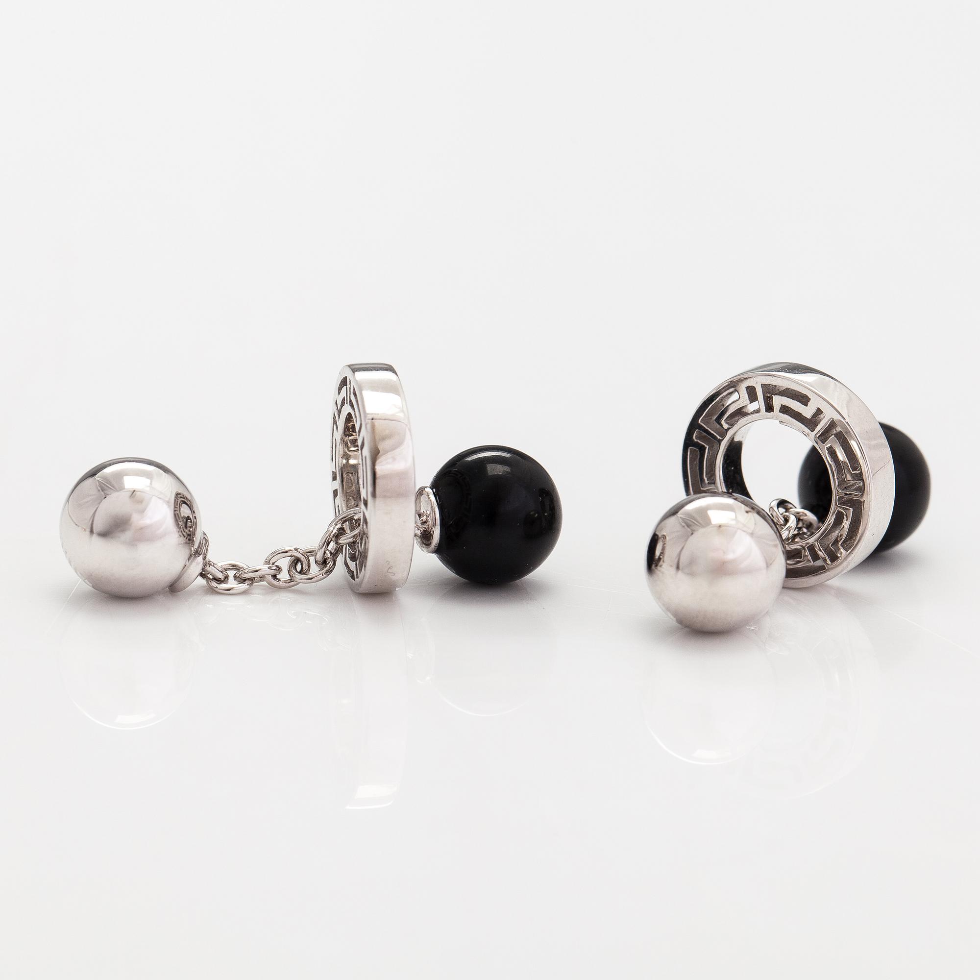 Versace, a pair of 18K white gold cufflinks with black glass pearls. marked Versace.