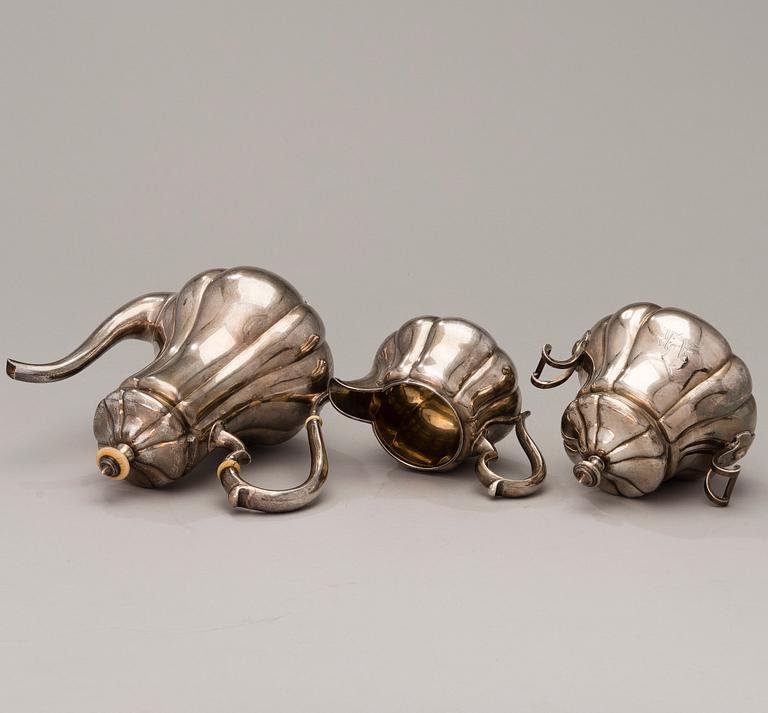 A 3-piece Russian silver coffee set, marks of Sazikov, St Petersburg 1869-70.