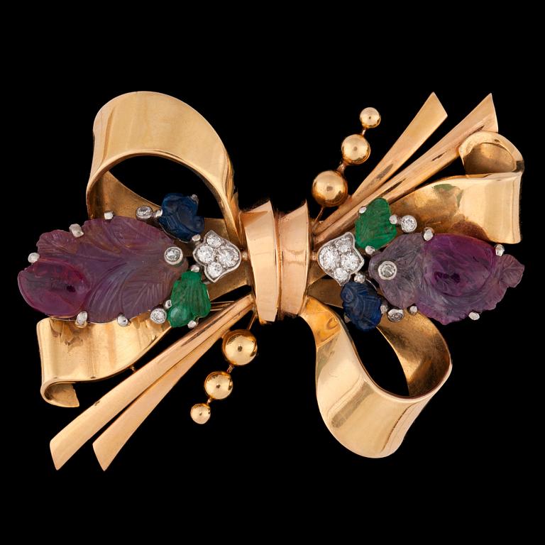 A carved ruby, sapphire, emerald and brilliant cut diamond brooch, 1920-40's.