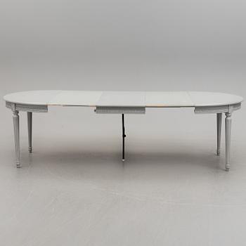 A Gustavian style dining table and ten chairs, 20th century.