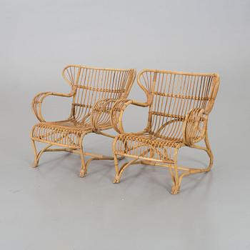 A mid 20th century ratten lounge chairs.