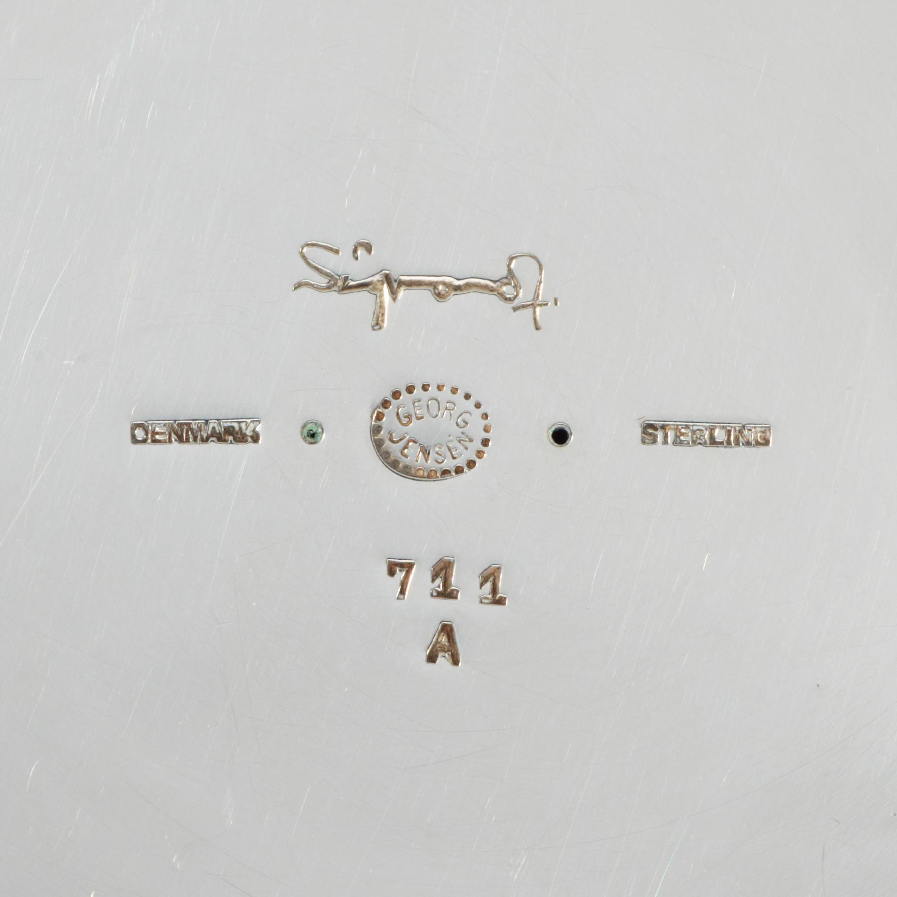 A pair of sterling Sigvard Bernadotte candlesticks.