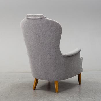A 'Farmor' easy chair by Carl Malmsten, late 20th century.