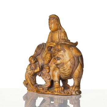 A well carved soapstone sculpture of Guanyin seated on Xiezhai, Qing dynasty, 18th/19th century.