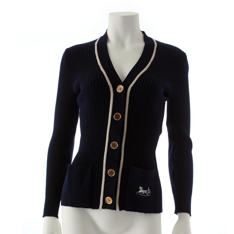 CÉLINE, a navy blue cardigan.