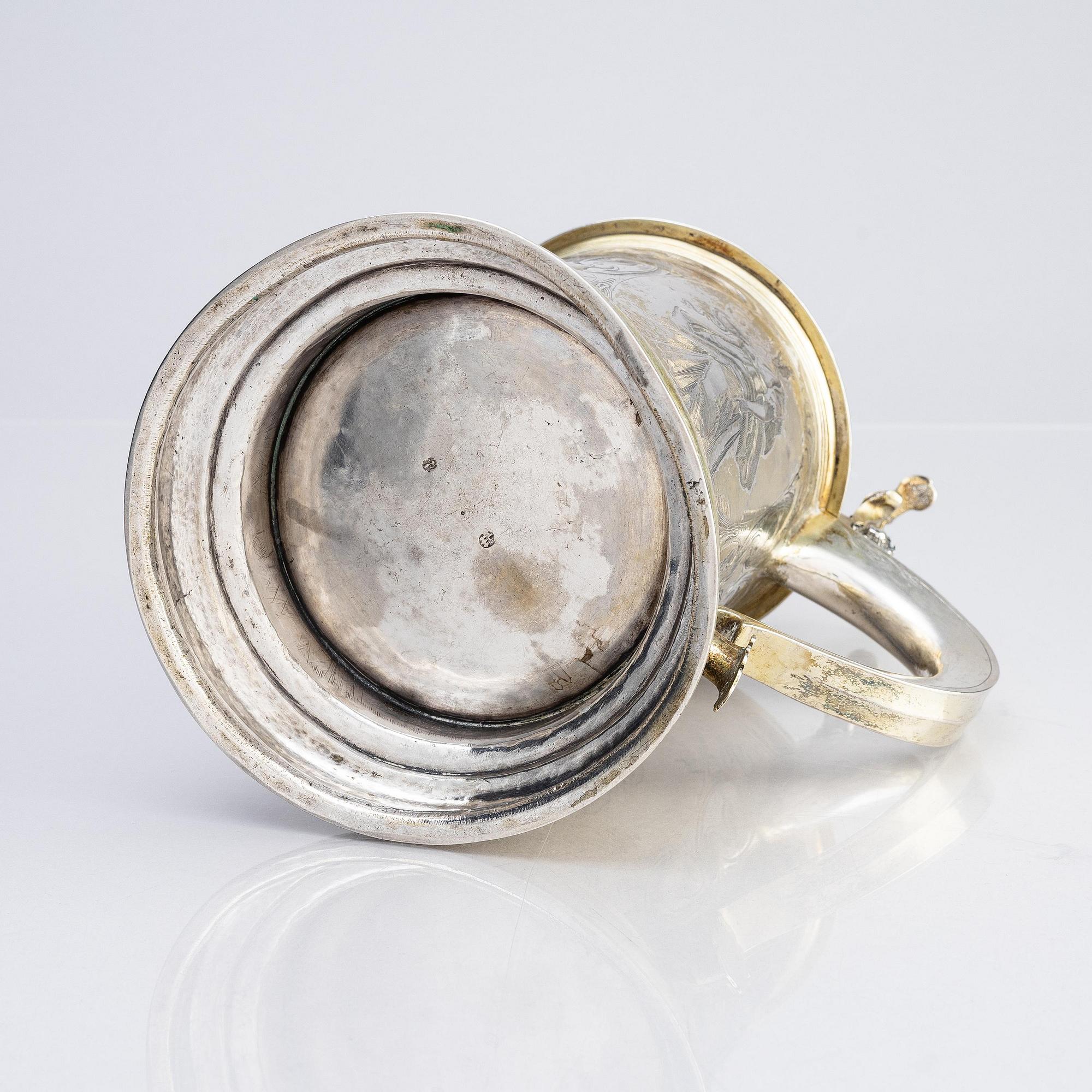 A German parcel-gilt silver tankard, mark of Walter Kopman, Hamburg (1649-1688).