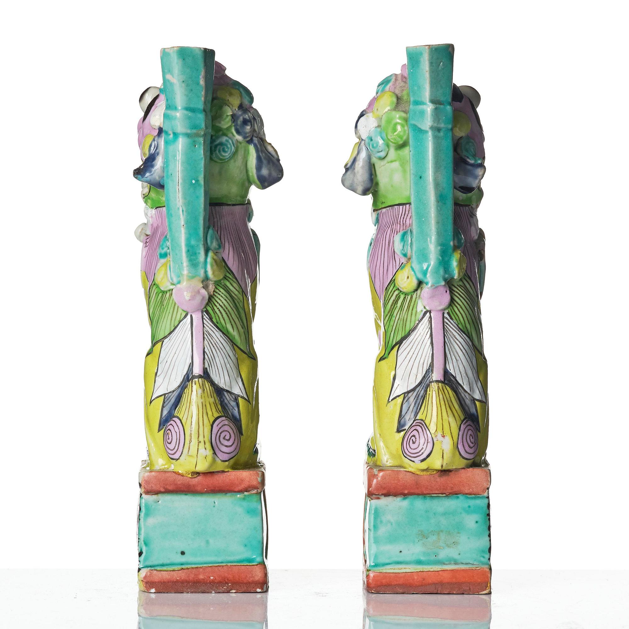 A pair of famille rose 'buddhist lion' joss stick holders, Qing dynasty, circa 1800.