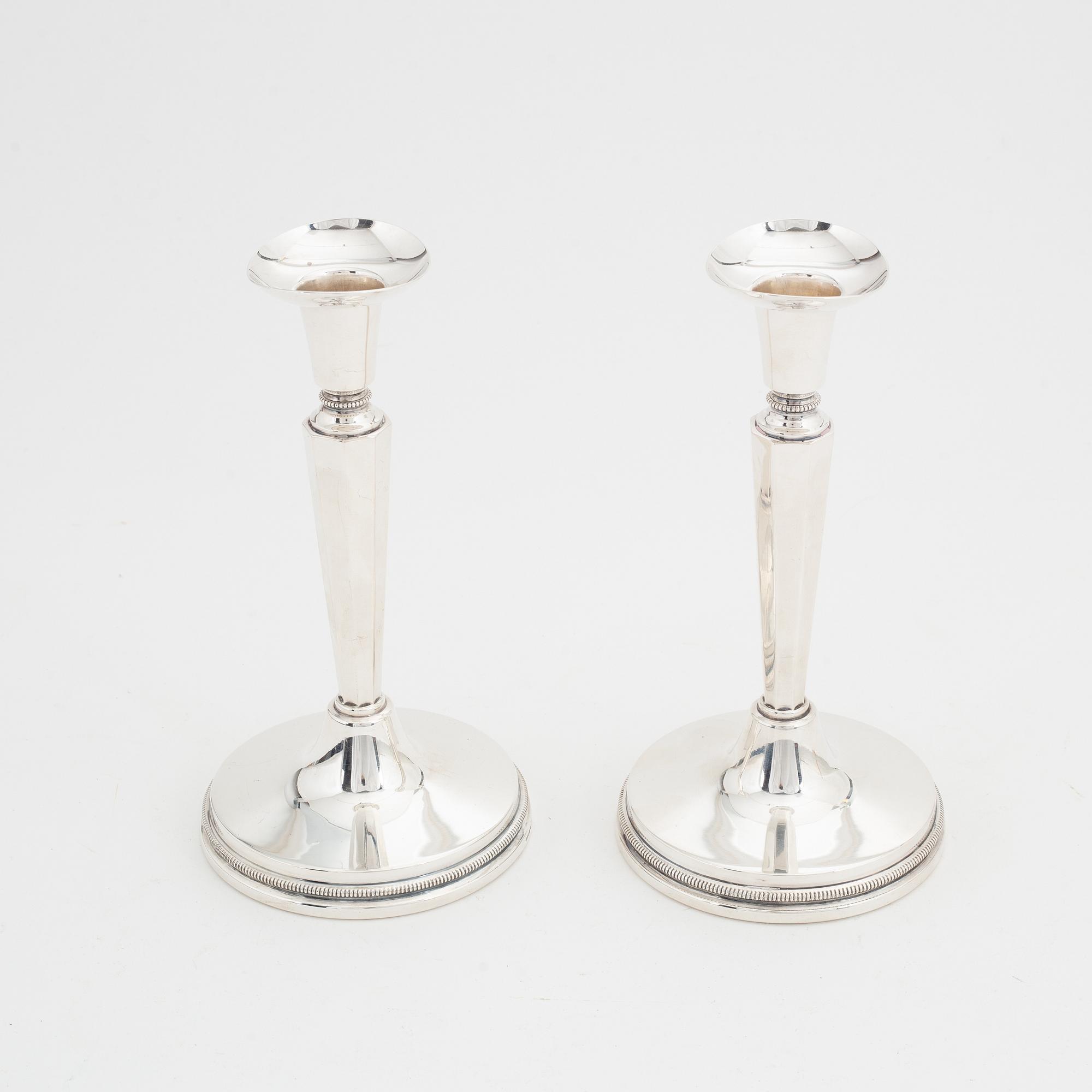 Eric Löfman, a pair of silver candlesticks, MGAB, Uppsala, 1976.