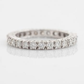 Brilliant cut diamond eternity ring.