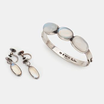 141. Wiwen Nilsson, a sterling and moonstones bangle with a pair of matching earrings, Lund Sweden 1937 ( bangle) and 1956.