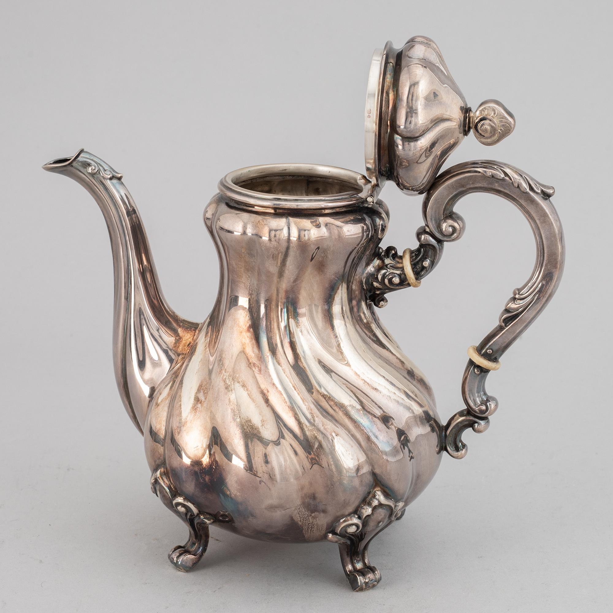 A silver coffee pot, creamer, sugar bowl and tray, swedish import mark.