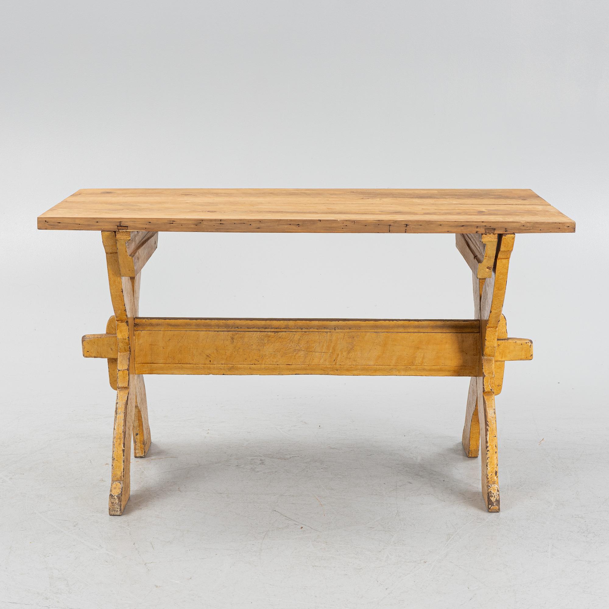A pianted trestle table, 19th Century.