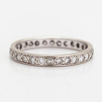 An 18K white gold eternity ring with brilliant-cut diamonds totalling approximately 0.60 ct.