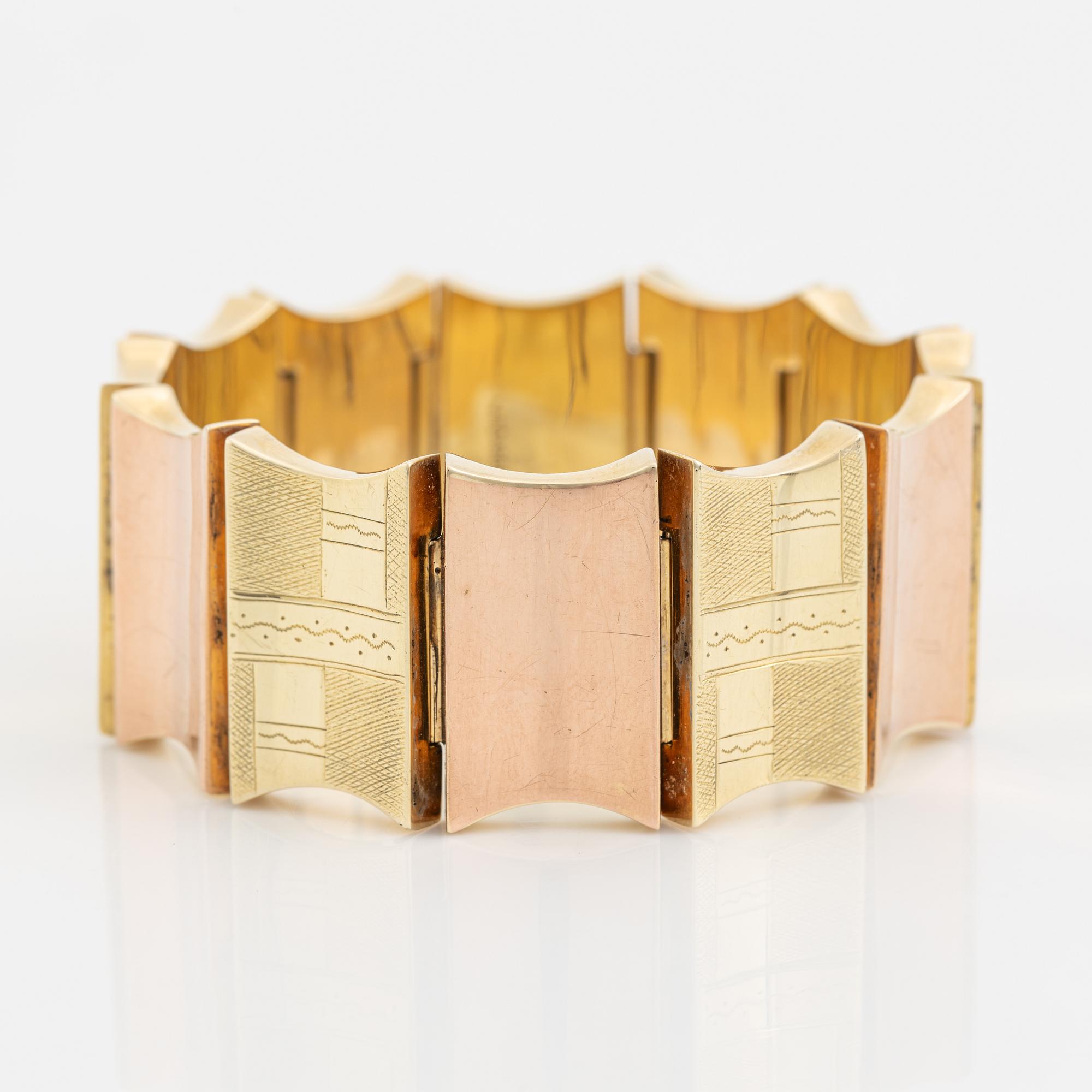 A 14K gold bracelet.