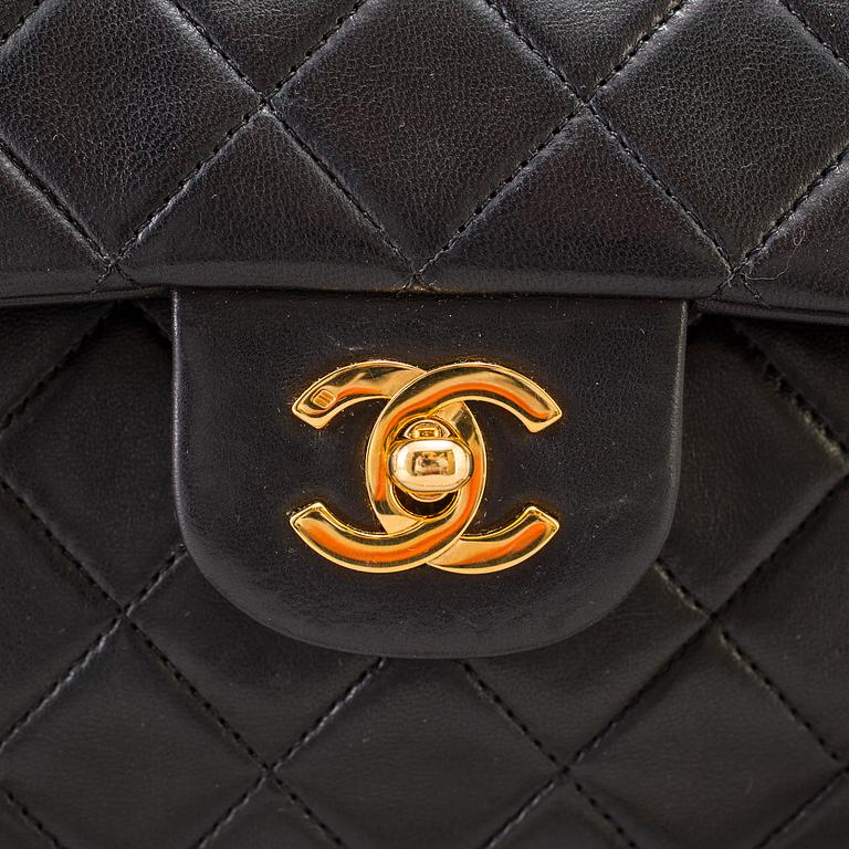 A "Double Flap bag" by Chanel.